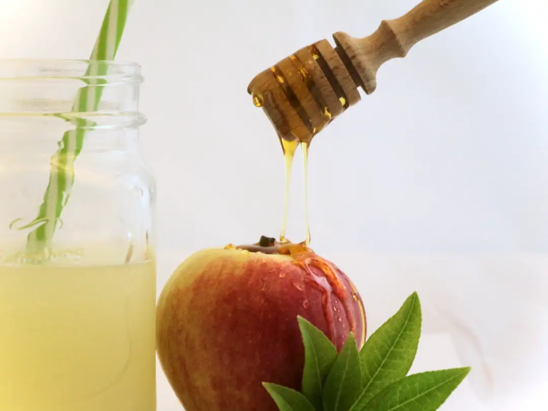 Honey dripping onto apple